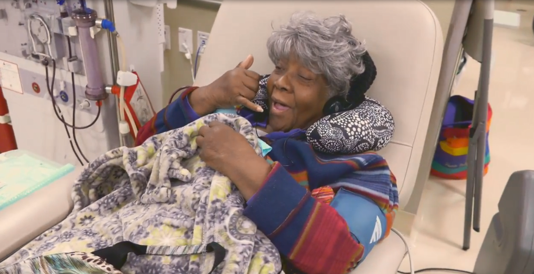 A patient laughs through dialysis treatment